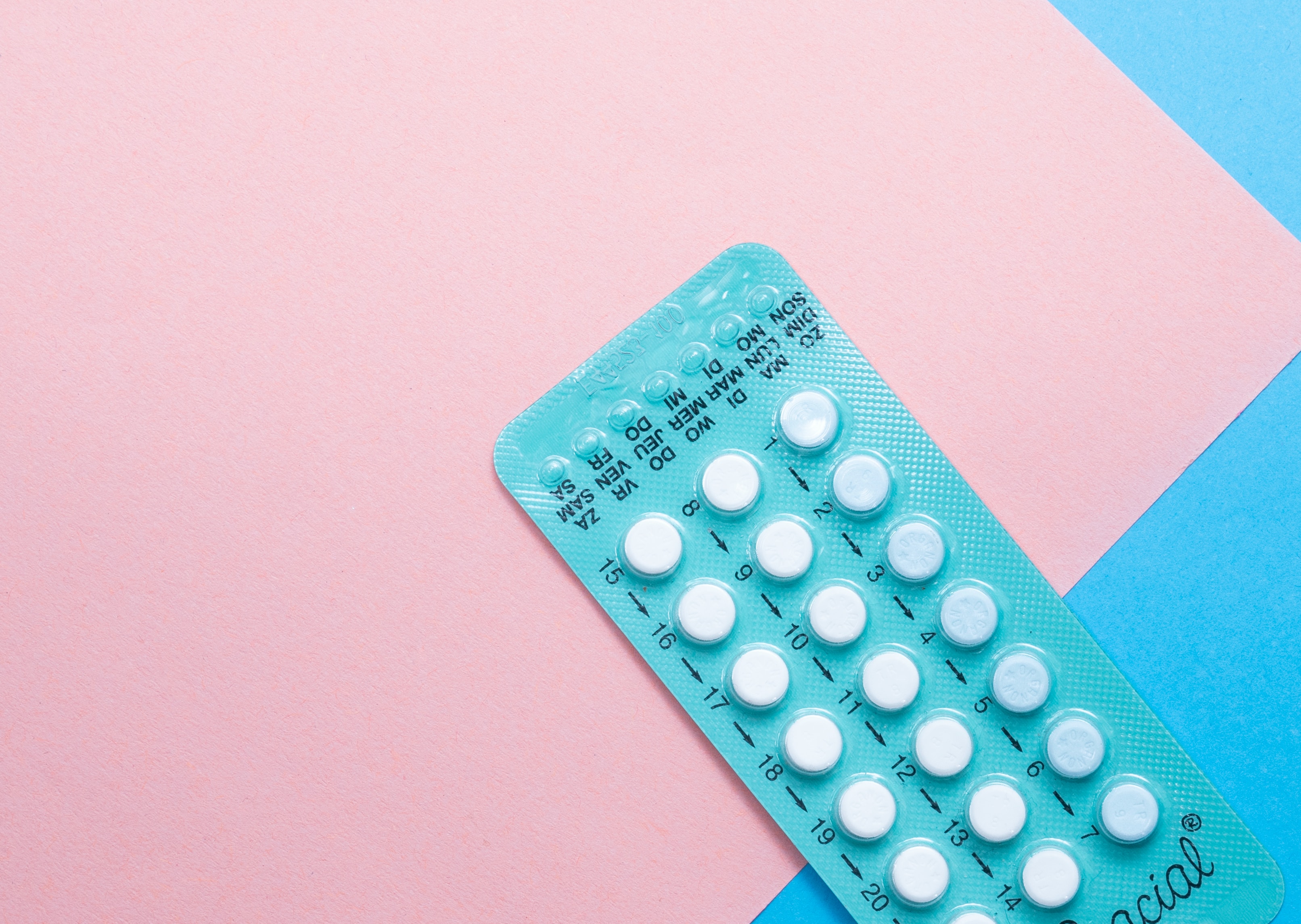 Pill pack on blue pink background