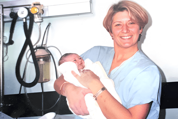 Helen Crabtree-Spencer with the last baby she delivered as a student midwife
